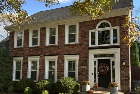 Windows Platinum Conservation Series Platinum Conservation Series replacement windows on a brick two-story home by Mengel Exteriors